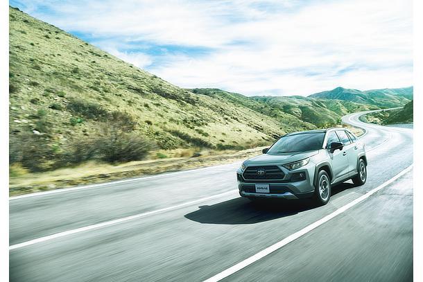 Toyota RAV4 driving on a scenic road