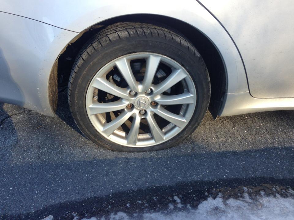 Low profile tire showing sidewall damage