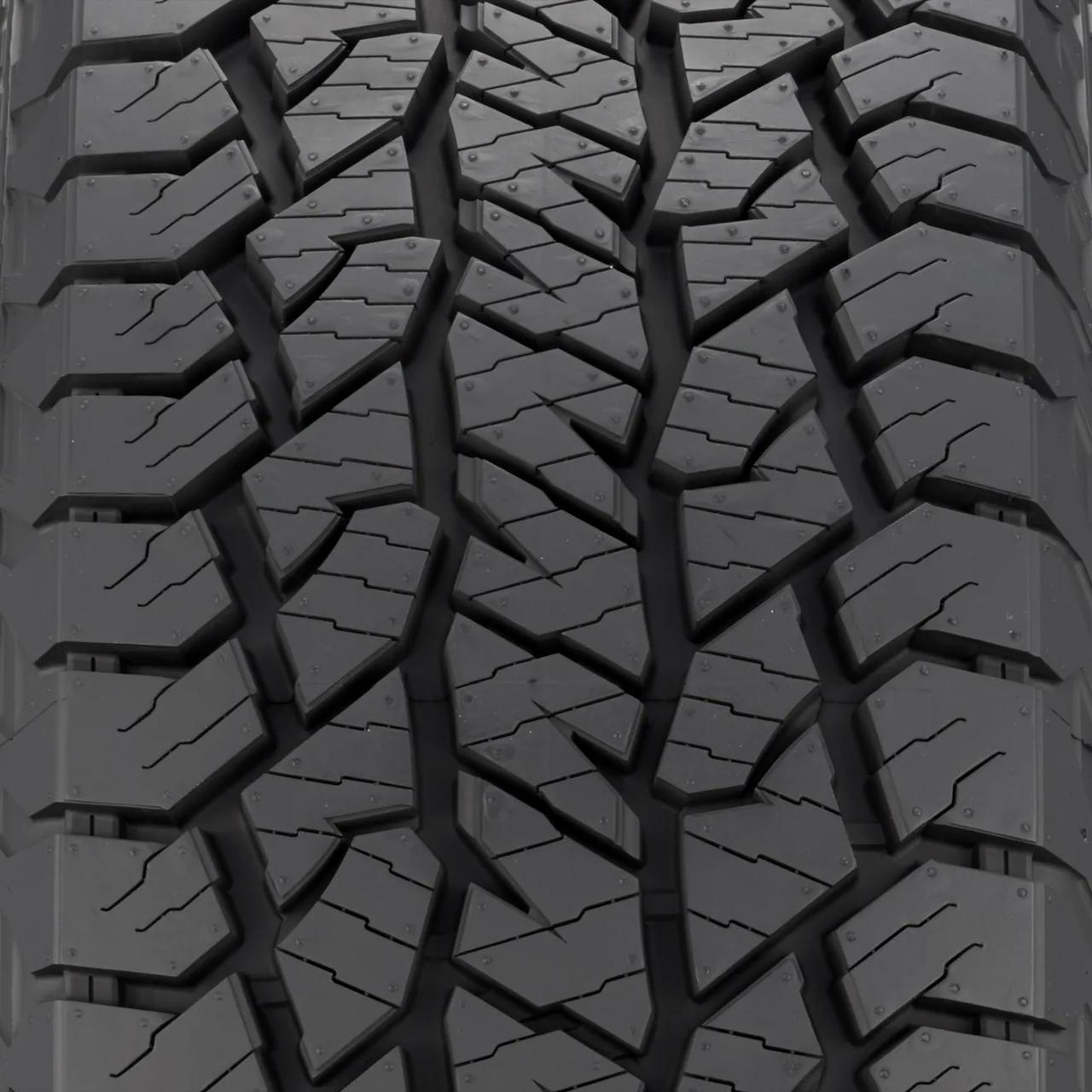 Ford F-150 tire tread pattern closeup showing all-terrain block design