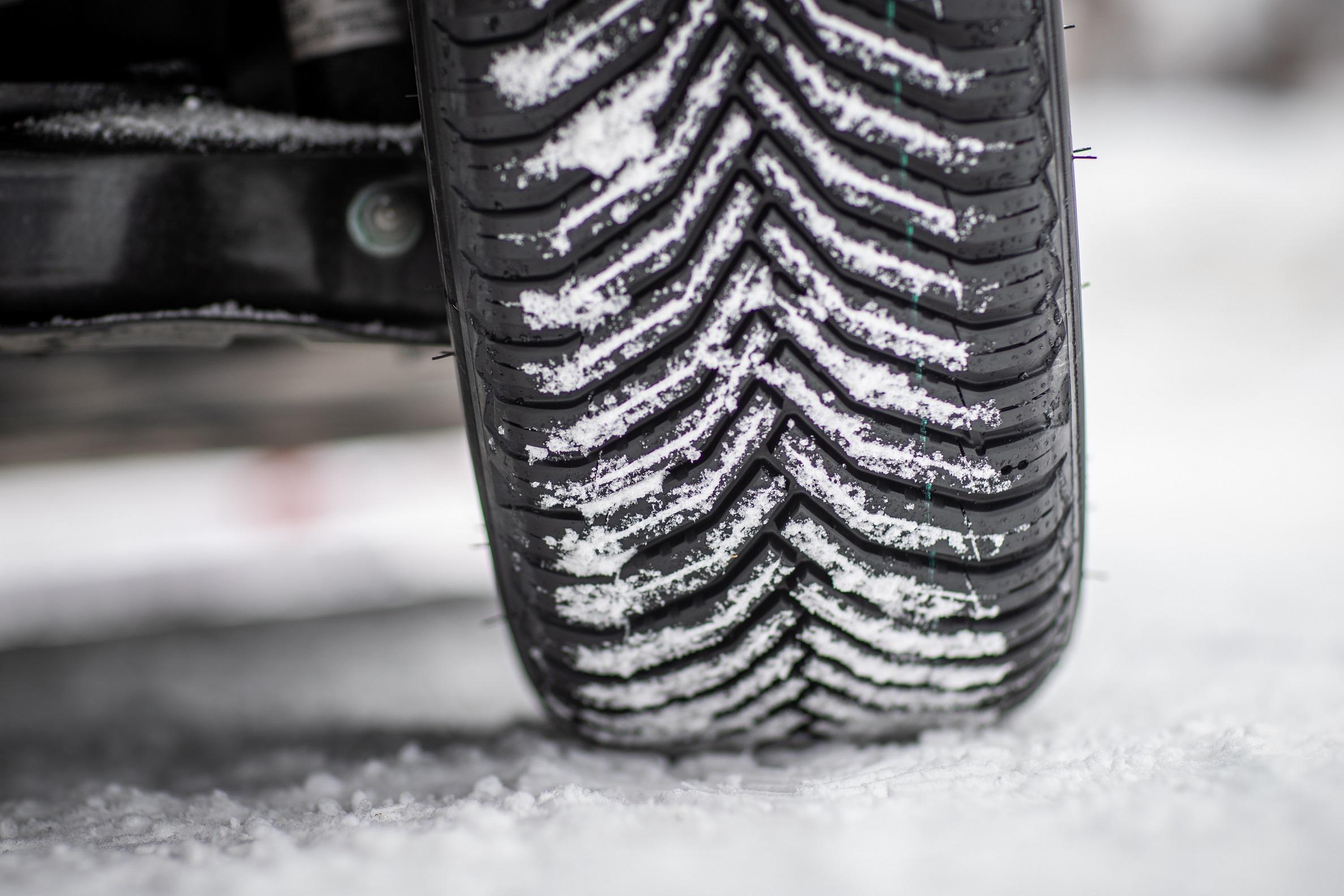 Michelin CrossClimate 2 tire in winter road conditions with the 3PMSF snowflake symbol visible