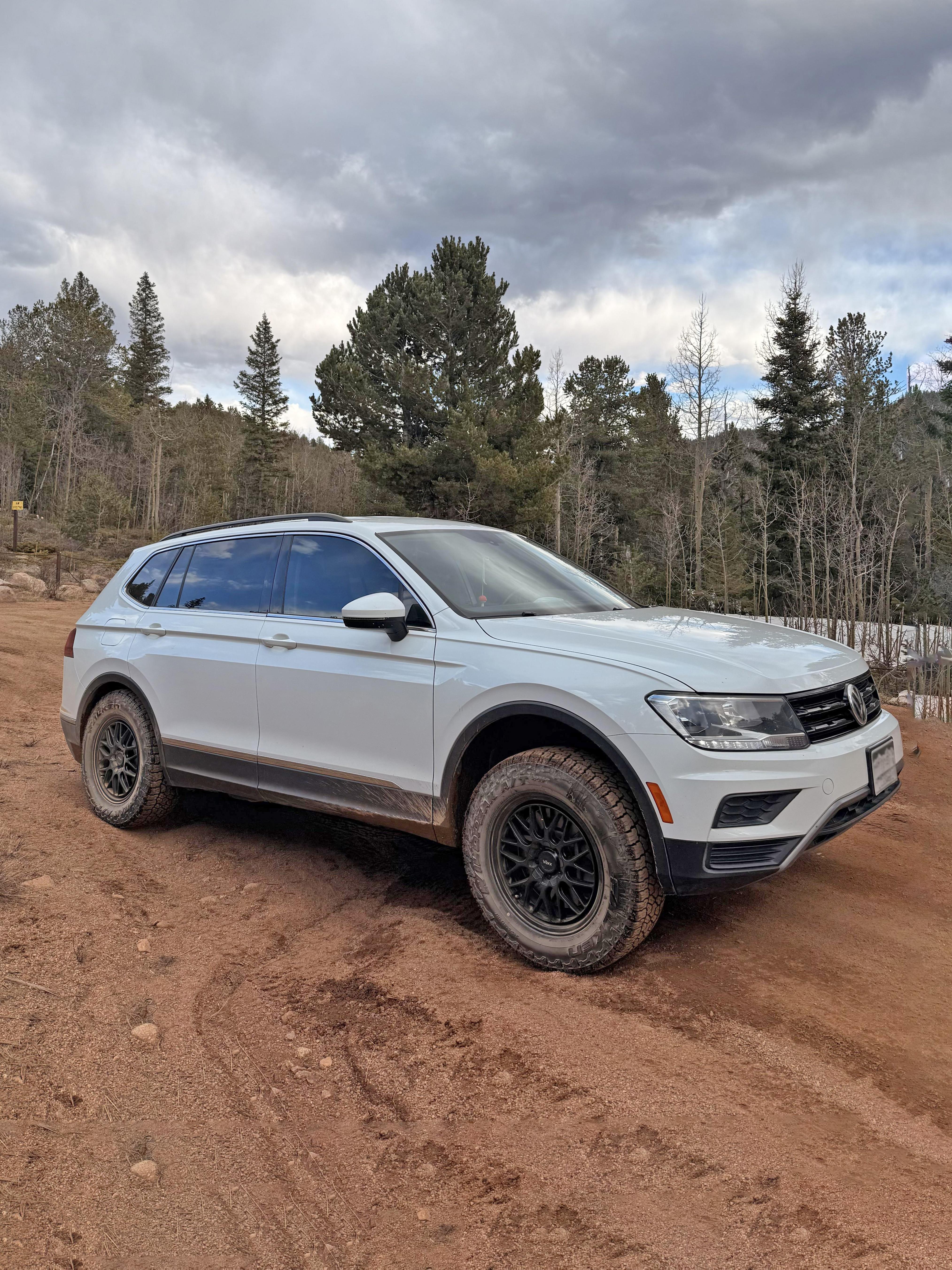 Tiguan with larger all-terrain tires showing lifted stance